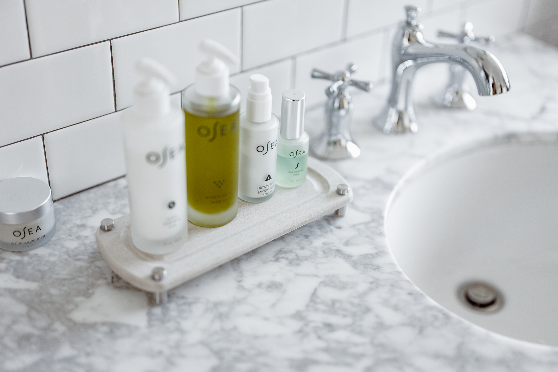 bathroom skin care products on a sink cady