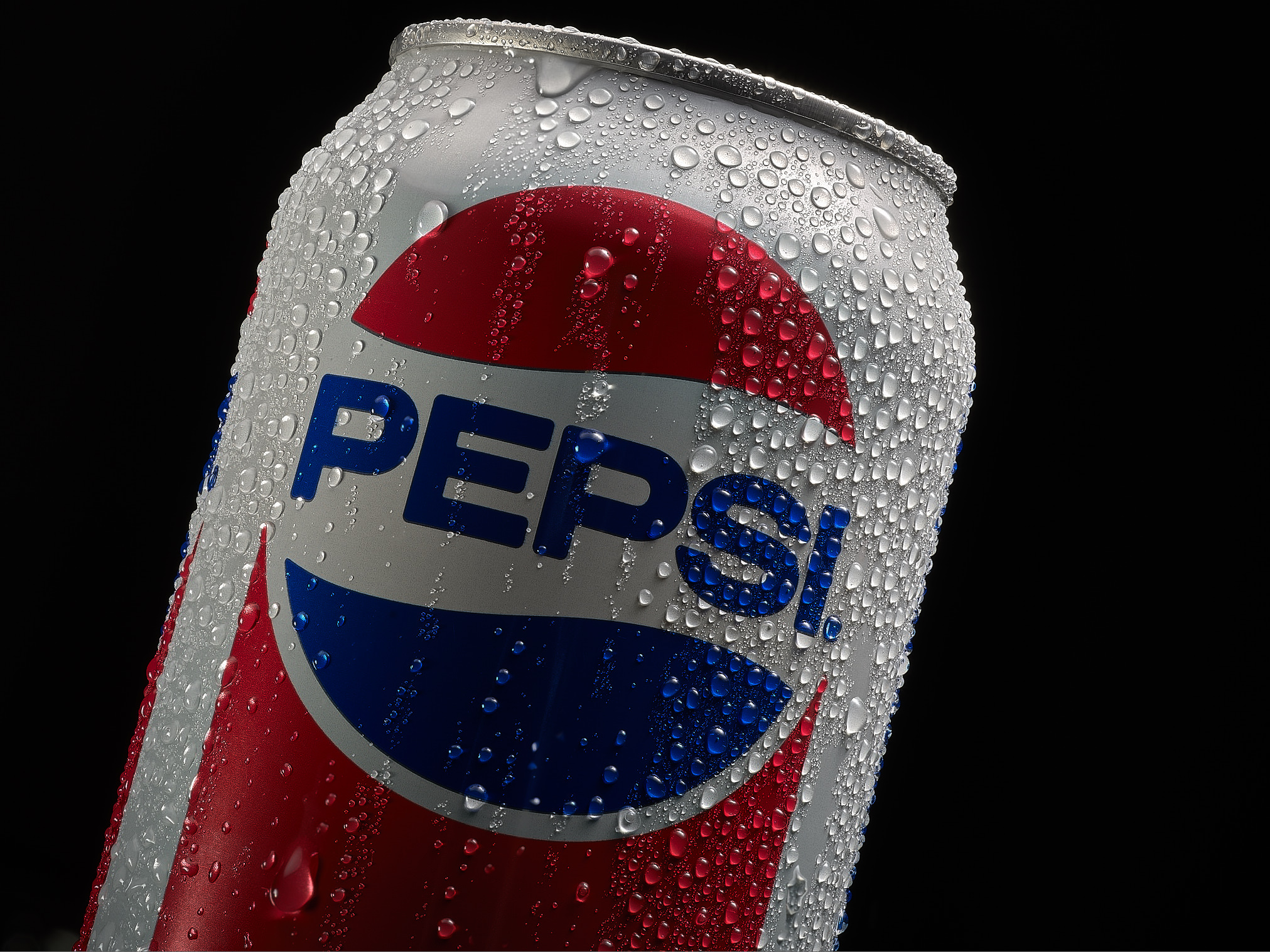 Water dripping down a cold refreshing Pepsi can On a black background With closer detail